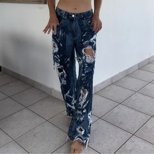 Ripped, baggy jeans with floral print.